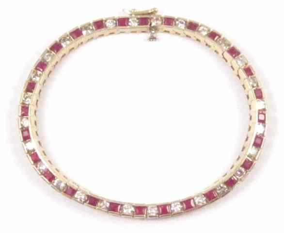 Appraisal: RUBY DIAMOND AND YELLOW GOLD BRACELET The k gold bracelet