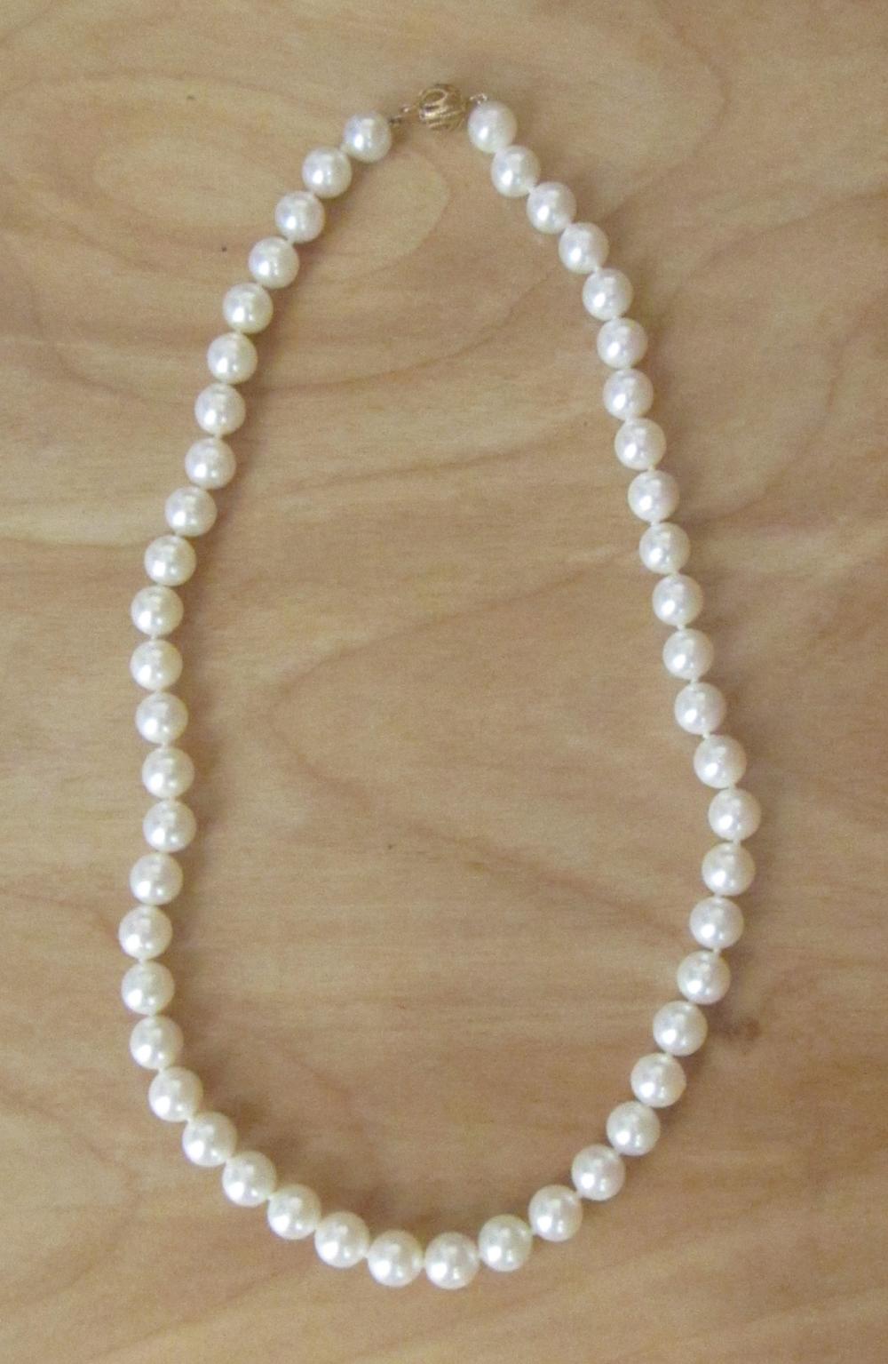 Appraisal: PRINCESS LENGTH PEARL AND FOURTEEN KARAT GOLD NECKLACE hand-knotted with