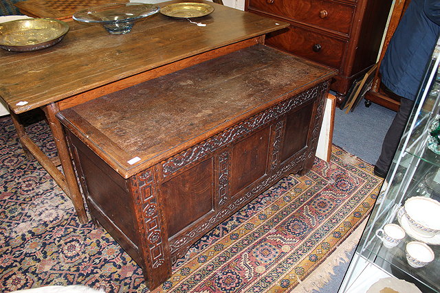 Appraisal: AN ANTIQUE OAK COFFER with three panelled front carved with