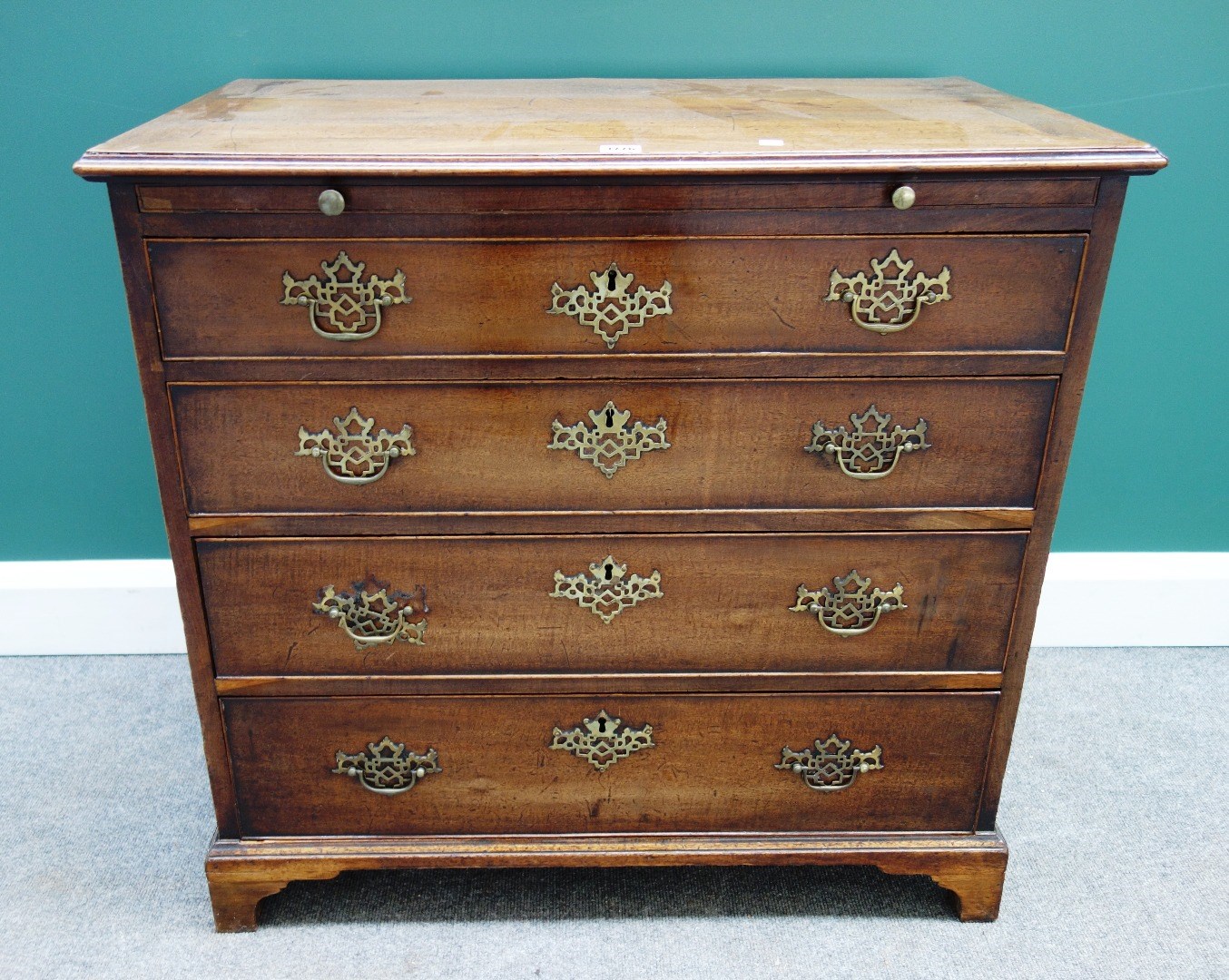 Appraisal: A mid th century mahogany chest the brushing slide over