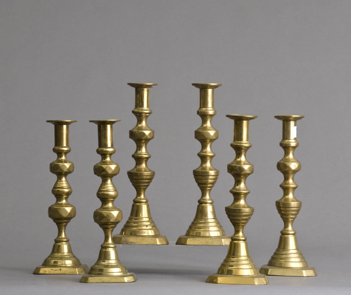 Appraisal: THREE PAIR OF ENGLISH BRASS CANDLESTICKS Height of tallest pair