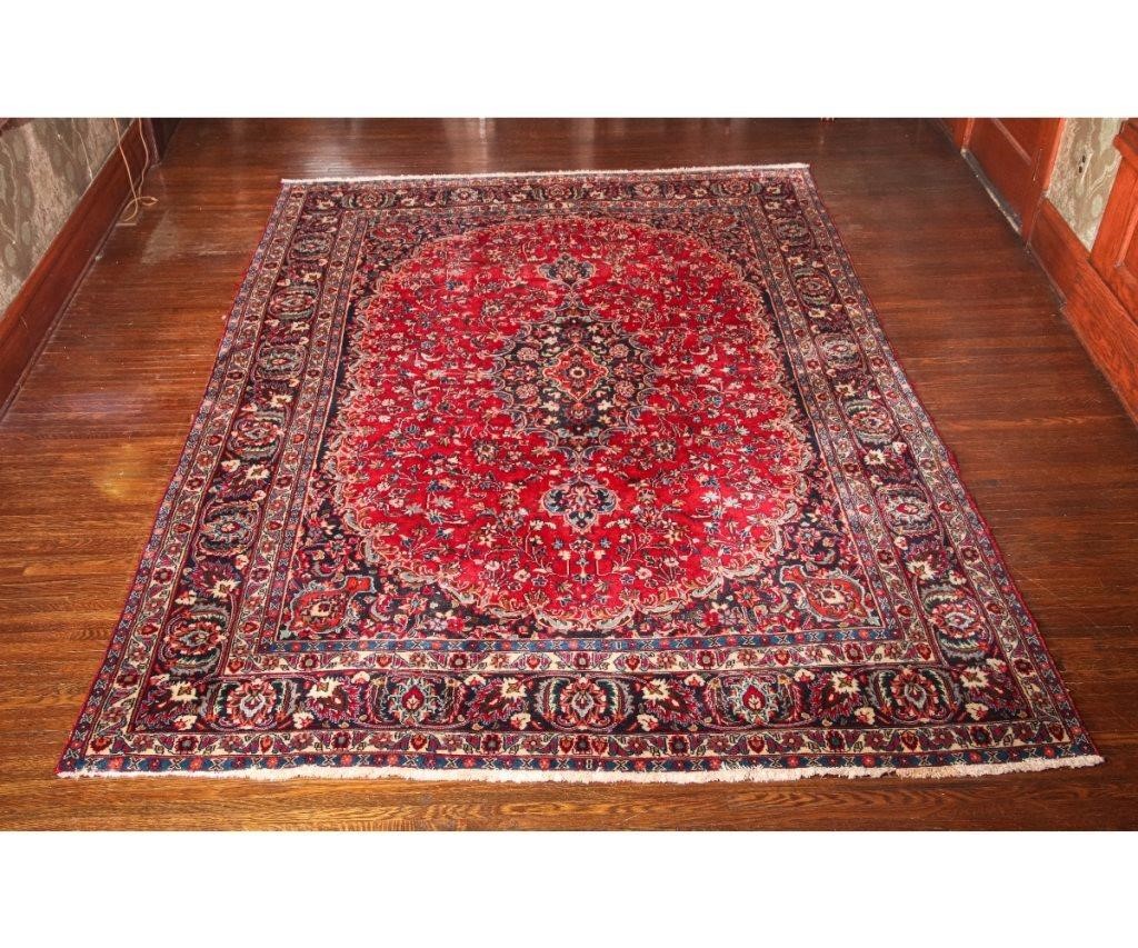 Appraisal: Persian room size carpet with red field and floral pattern