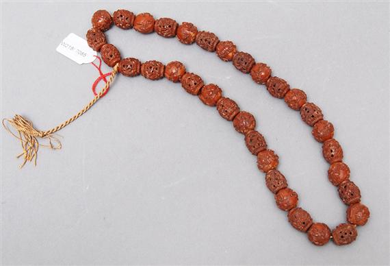 Appraisal: A CARVED KERNEL NECKLACE China L cm