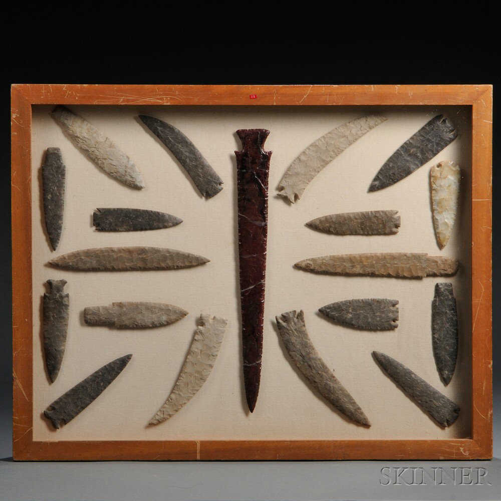 Appraisal: Large Framed Group of Reproduction Stone Items largest blade broken