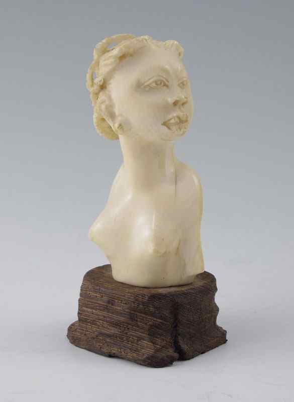 Appraisal: CARVED IVORY BUST AFRICAN WOMAN Mounted on wood base Ivory