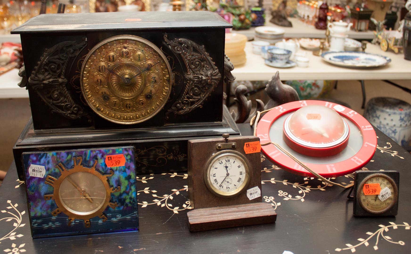 Appraisal: Assortment of clocks including iron mantel clock blue glass deco