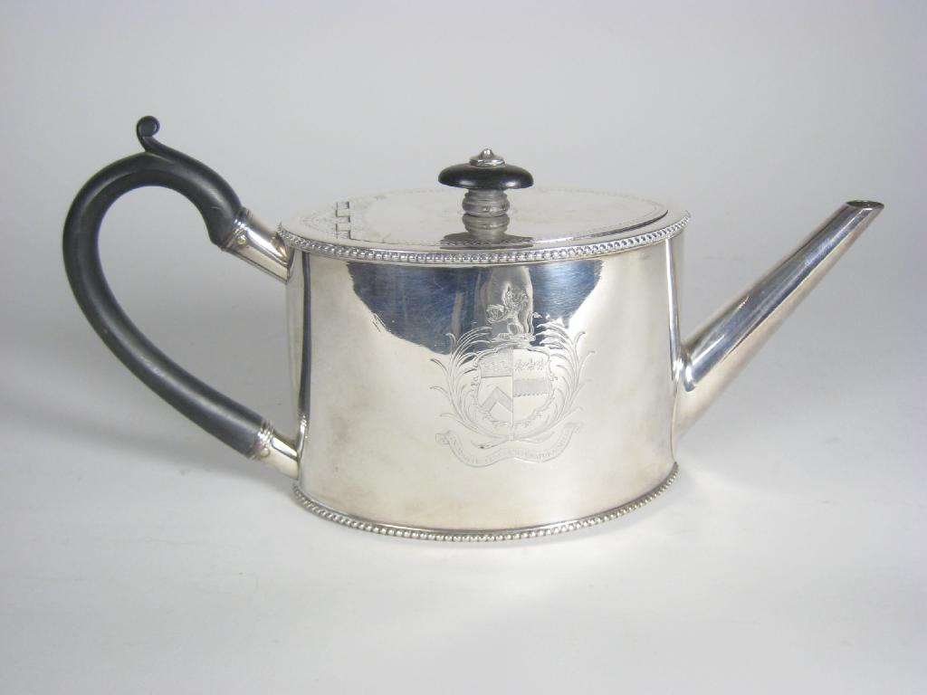 Appraisal: A George III oval Teapot with beaded rim and engraved