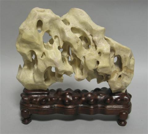 Appraisal: A CHINESE SCHOLAR'S STONE The material of soft whitish cream