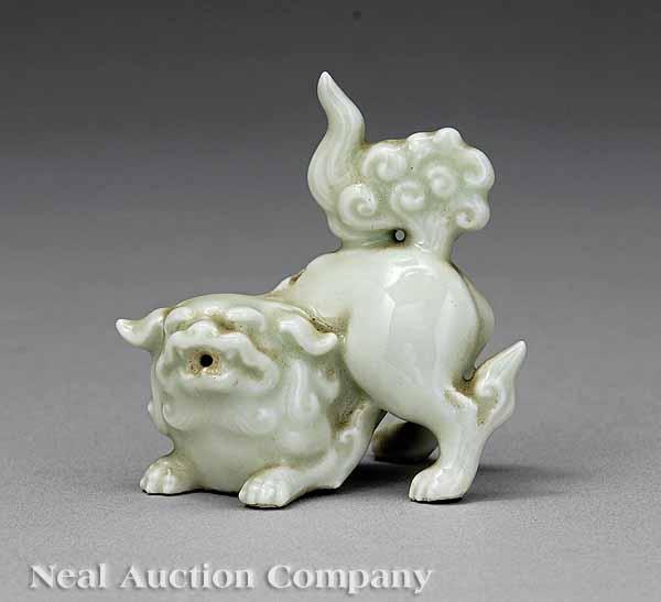 Appraisal: A Japanese Nabeshima-Style Celadon Glazed Porcelain Figure of a Small