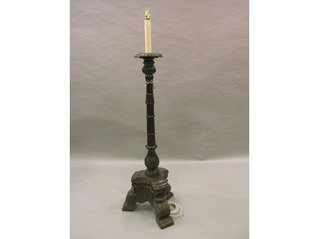 Appraisal: A th century-style carved wood torchere with carved detail deeply