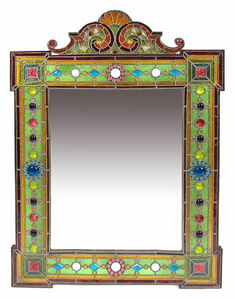 Appraisal: An Arts and Crafts mirror with inset stained glass panels