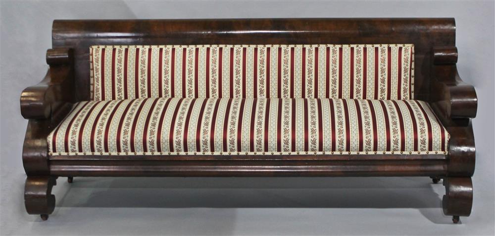 Appraisal: AMERICAN EMPIRE MAHOGANY SOFA having a straight mahogany rail with