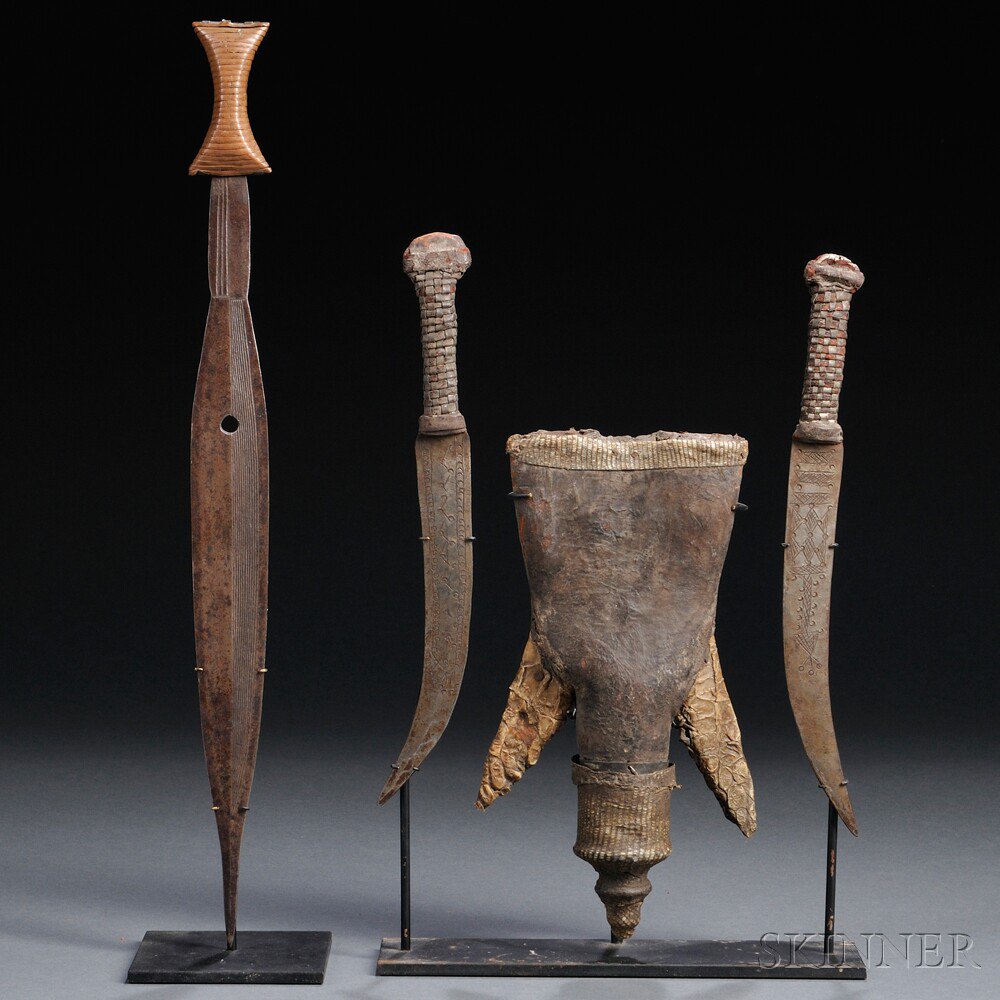 Appraisal: Two African Weapons a Sudanese skin-covered double knife set and