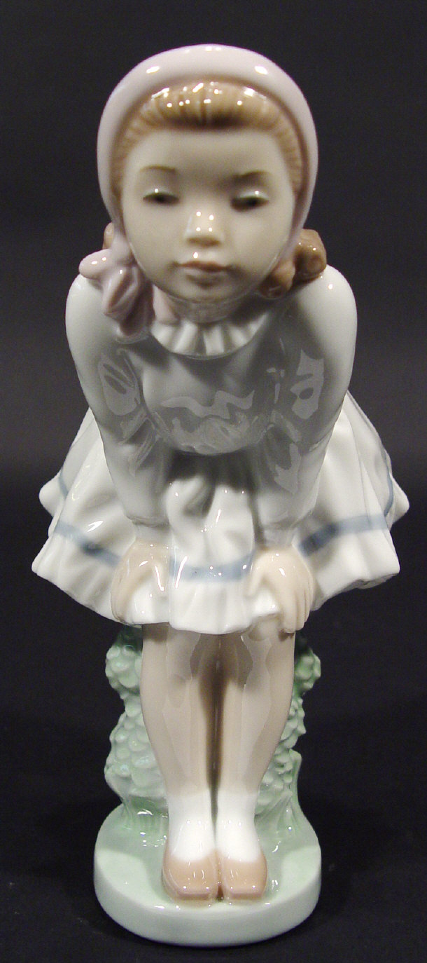 Appraisal: Nao porcelain figurine of a young girl in dress with