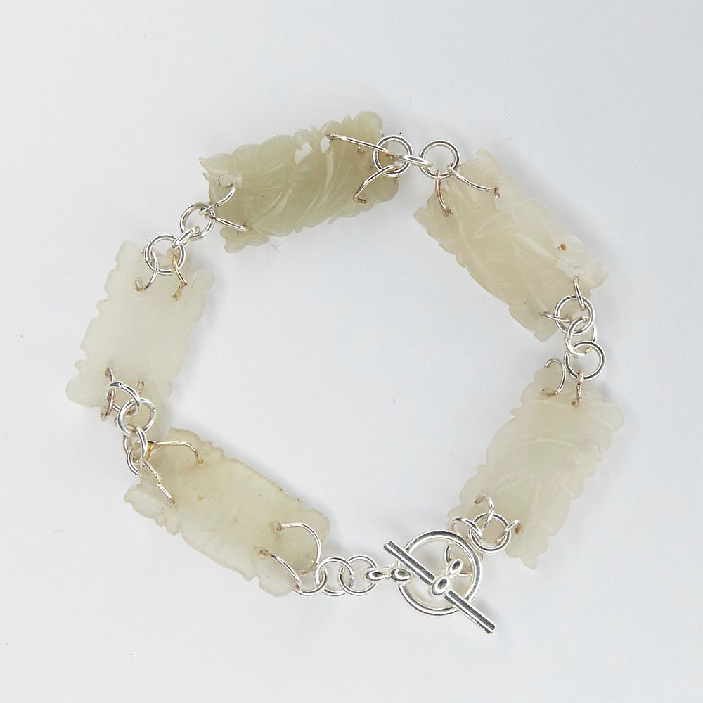 Appraisal: Bracelet w Chinese Jade Carvings Handmade bracelet made up of