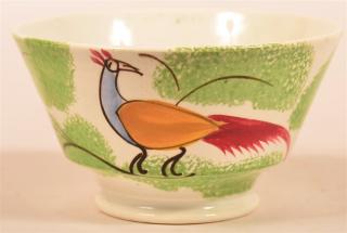 Appraisal: Green Spatter Peafowl China Tea Bowl Blue mustard and red