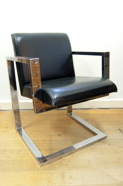 Appraisal: BLACK AND CHROME ARM CHAIR