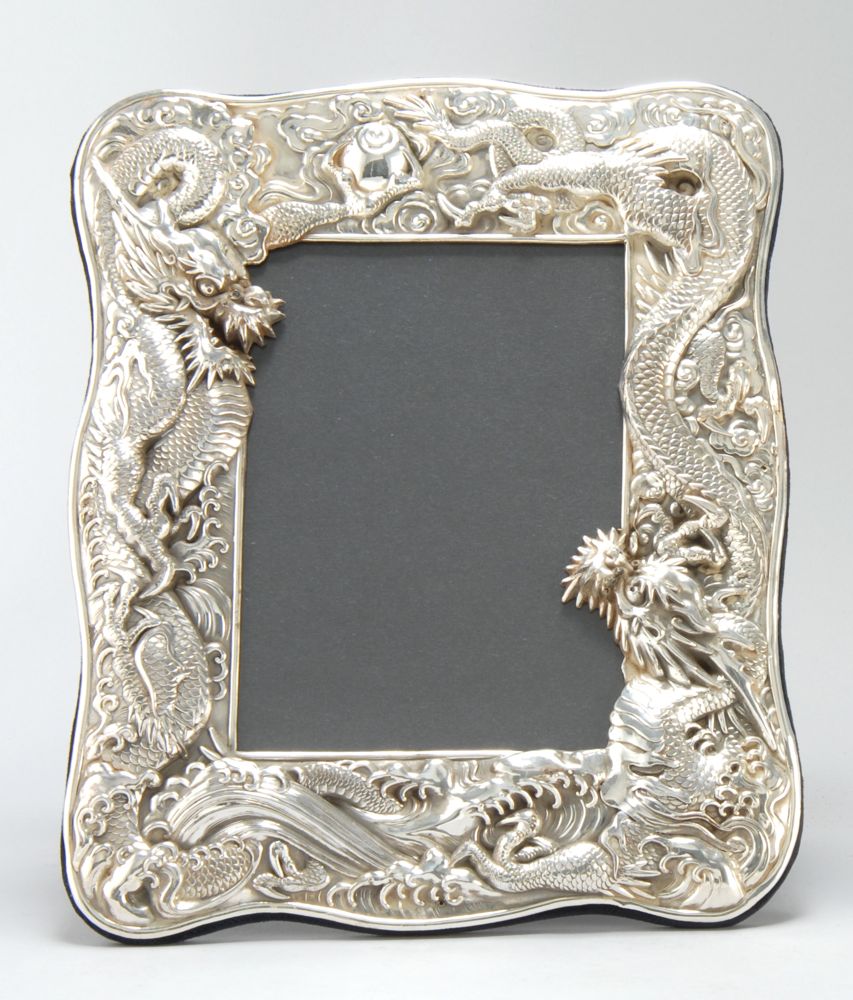 Appraisal: STERLING SILVER PICTURE FRAME In a Chinese motif with applied