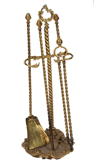 Appraisal: A BRASS COMPANION SET consisting of a poker tongs and