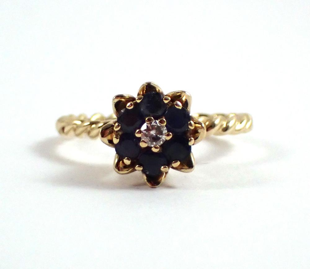 Appraisal: SAPPHIRE DIAMOND AND FOURTEEN KARAT GOLD RING with six round-cut