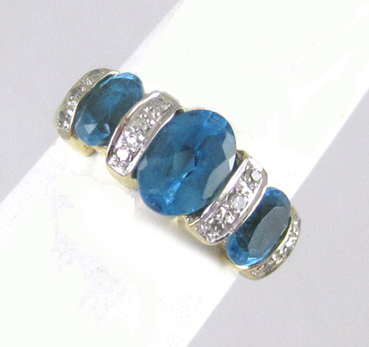 Appraisal: BLUE TOPAZ DIAMOND AND FOURTEEN KARAT GOLD RING set with