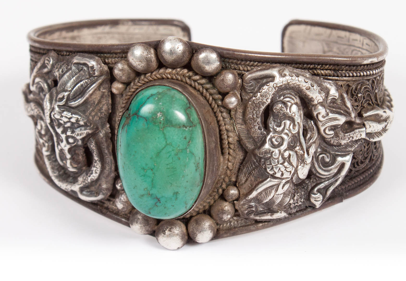 Appraisal: Chinese silver cuff bracelet with a green turquoise center stone