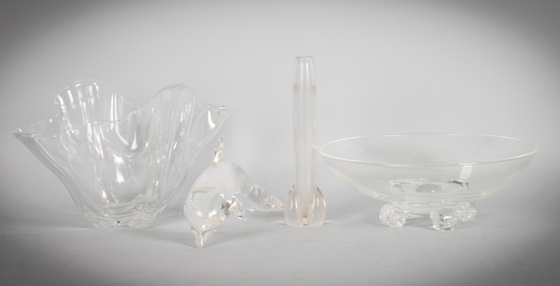 Appraisal: Four Steuben glass articles including centerbowl with scroll feet dolphin