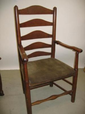 Appraisal: AN ASH AND ELM ELBOW CHAIR of ladderback form comprising