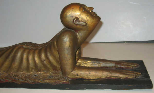 Appraisal: BURMESE TH CENTURY CARVED GILT WOODEN FIGURE Lying on stomach