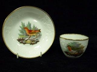 Appraisal: A Spode cup and saucer circa with moulded floral sprays