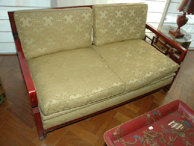 Appraisal: A CHINESE RED LACQUERED SETTEE The rectangular crest rail above