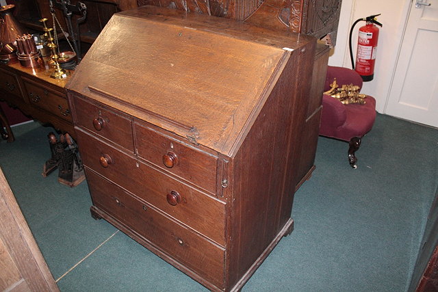 Appraisal: A GEORGE III OAK LARGE BUREAU the interior fitted with