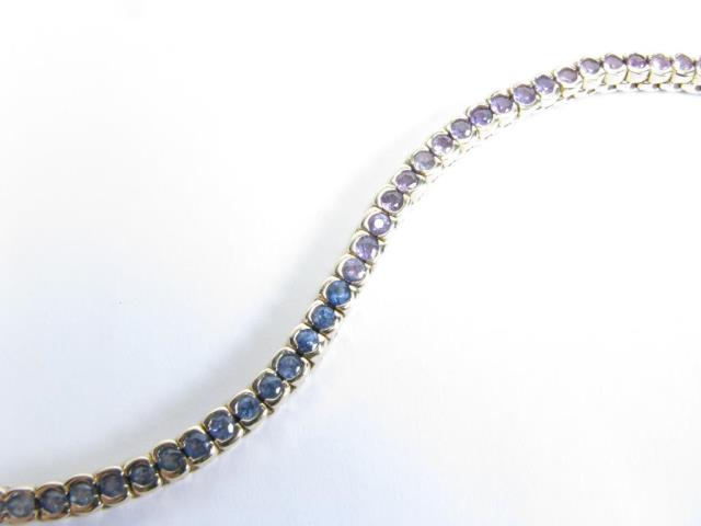 Appraisal: K yellow gold line bracelet with multi-colored sapphires in shades