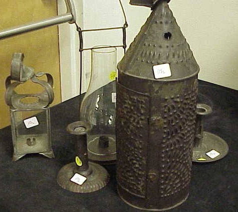 Appraisal: Group of tin lighting devices including a pierced tin lantern