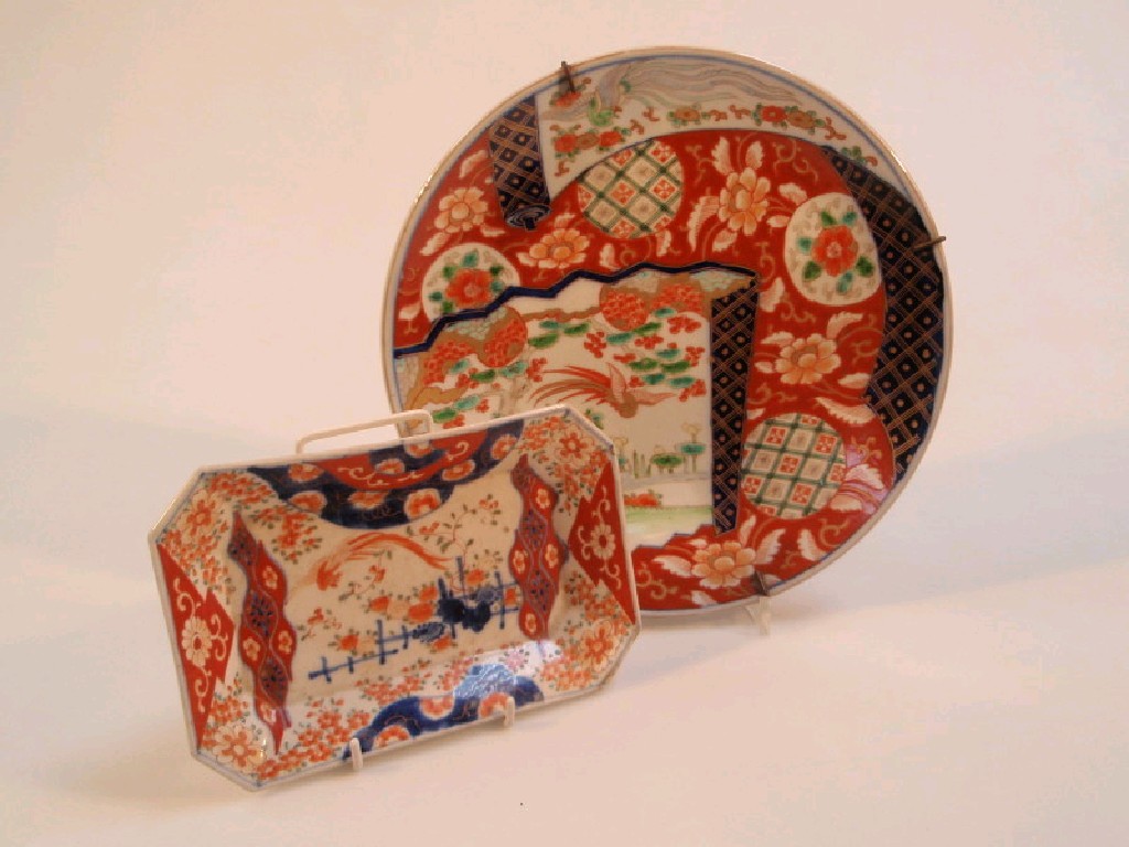 Appraisal: An Imari plate painted with asymmetrical panels of birds against