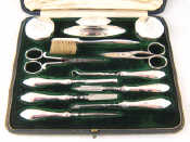 Appraisal: A lady's extensive silver mounted manicure set of twelve pieces