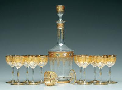 Appraisal: Gilt decorated decanter and goblets decanter with enameled floral and