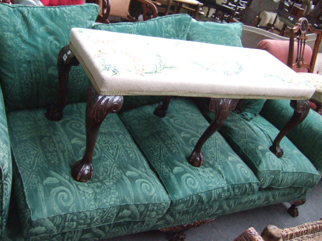 Appraisal: A th century walnut framed sofa the shaped hump back