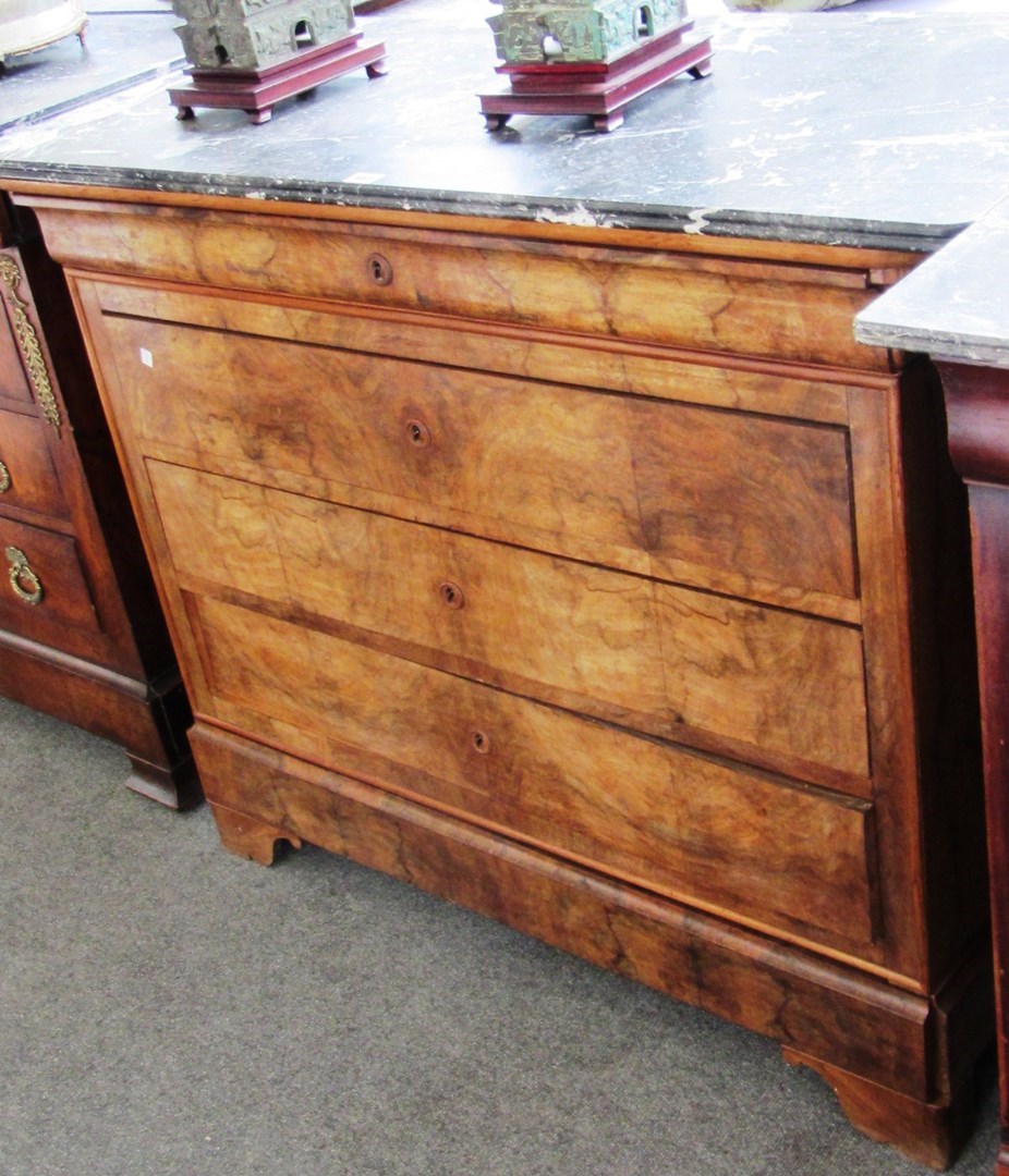 Appraisal: A French walnut Louis Phillipe commode the canted marble top