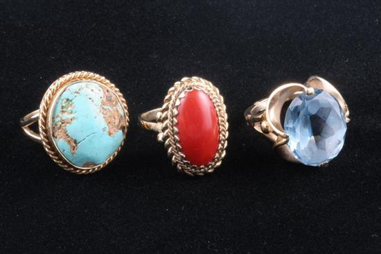 Appraisal: THREE YELLOW GOLD AND COLORED GEMSTONE RINGS Polished turquoise chunk