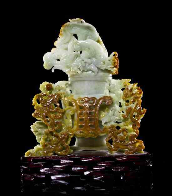 Appraisal: A Green and Russet Jadeite Lidded Vessel of brown and