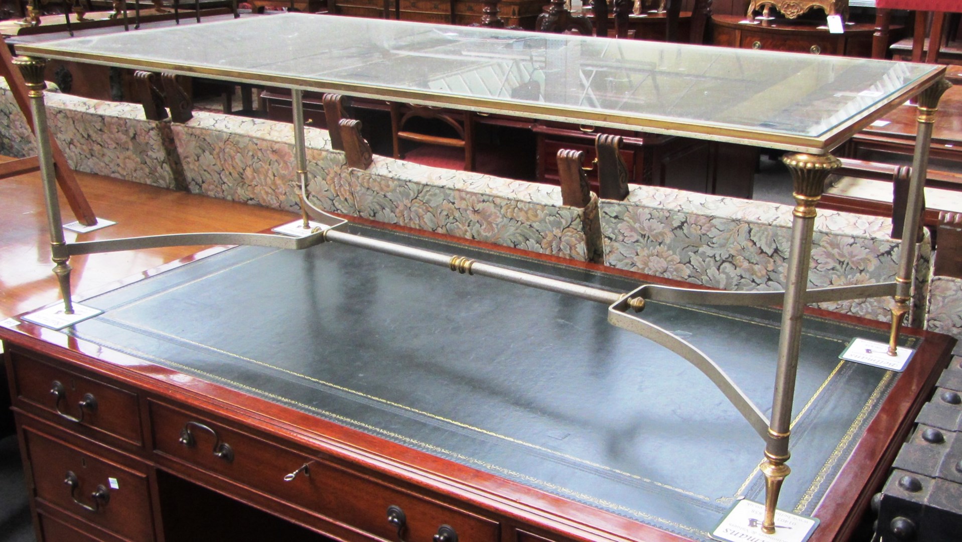 Appraisal: A th century polished steel and brass rectangular coffee table