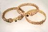 Appraisal: BRACELETS - Three K yellow gold and stone bangle bracelets