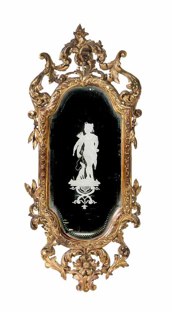 Appraisal: A Continental Giltwood Mirror having a foliate carved crest over