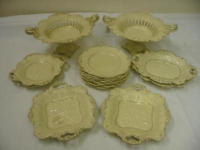 Appraisal: AN ENGLISH CREAMWARE DESSERT SERVICE comprising two comports six serving