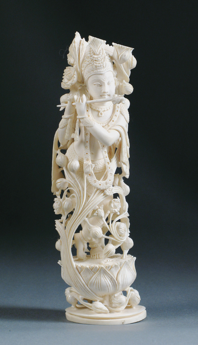 Appraisal: A SINO-TIBETAN ELEPHANT IVORY CARVING depicting a barefoot muse standing