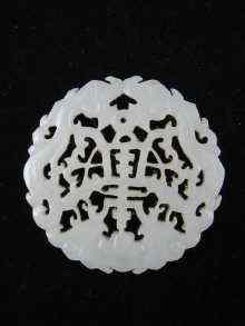 Appraisal: A pierced Chinese jade disc cm across