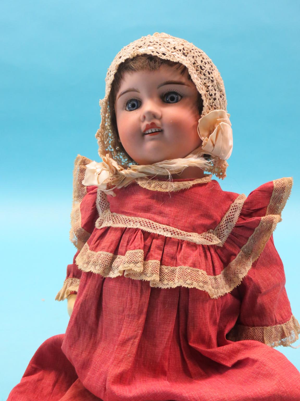 Appraisal: A French bisque doll J Verlingue fixed eyes and open-mouth