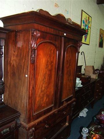 Appraisal: An early Victorian mahogany linen press the twin panelled doors