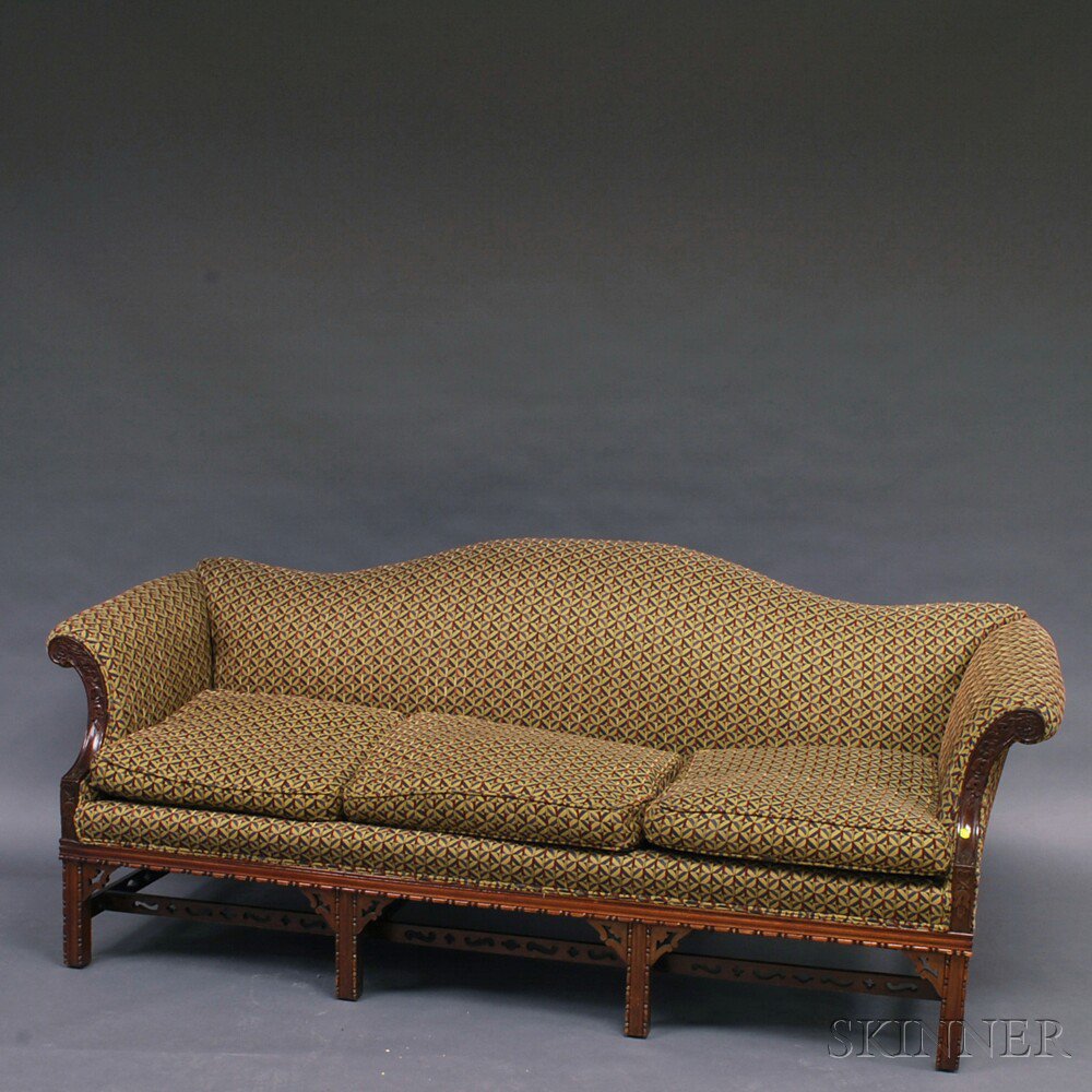 Appraisal: Chinese Chippendale-style Carved Mahogany Camel-back Sofa with floral-carved and scrolled